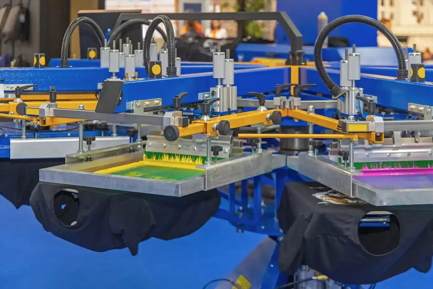 Wholesale screen printing bulk custom t-shirts production facility with high-volume printing machines